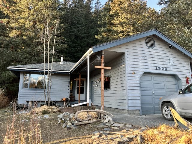 house with a garage in woods